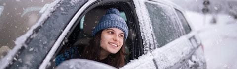 Woman driving in snow
