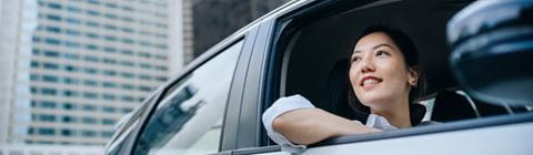 Woman looking out of car window