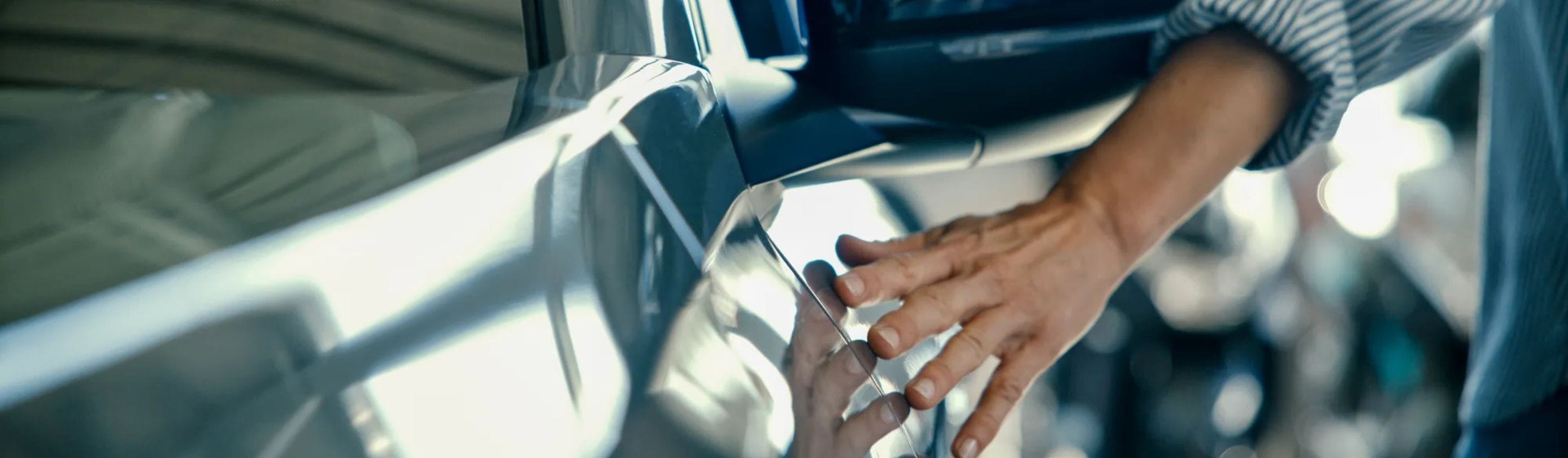 Hand touching car (1)