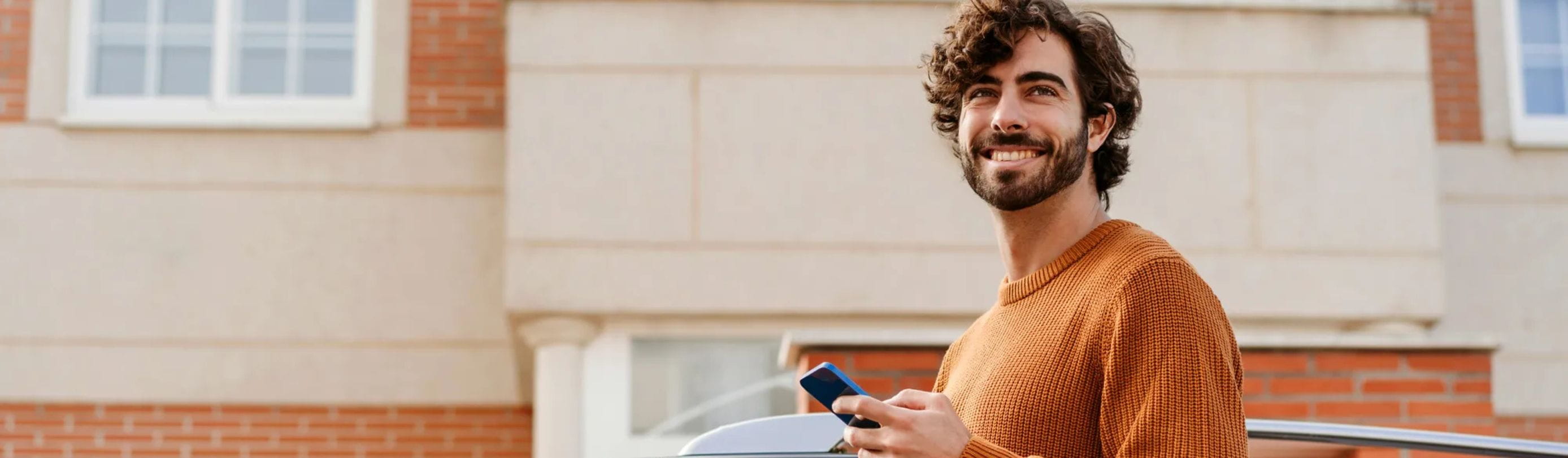 Man smiling with phone