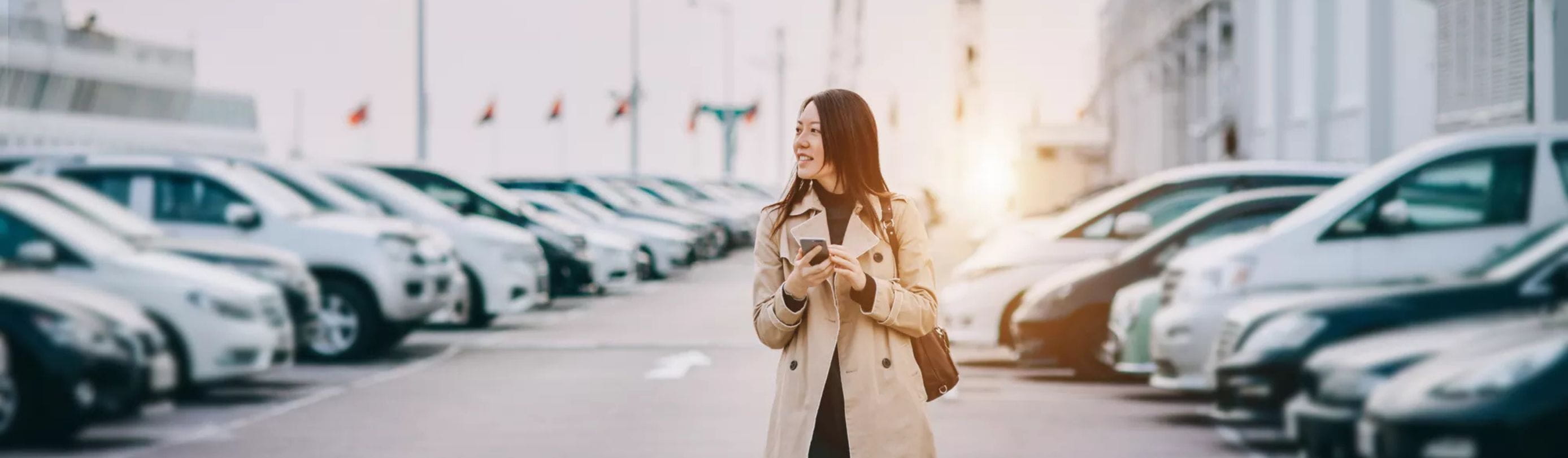 Woman on car lot